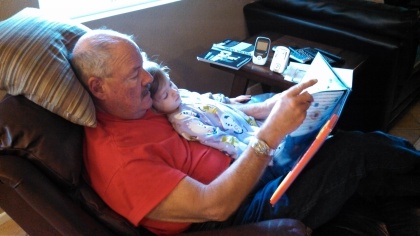Grandpa reading to Ella